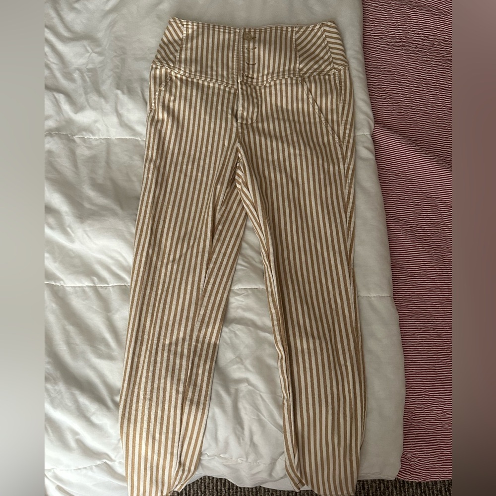 Striped beige and cream colored capris with buttons